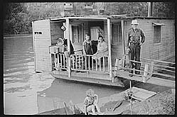 Family living on riverboat, Charleston, West Virginia. Husband now on WPA labor