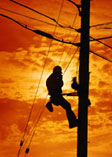Worker on electrical pole