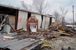 Crumpled metal and scattered debris are all that remains of the police station in Pass Christian, Miss.