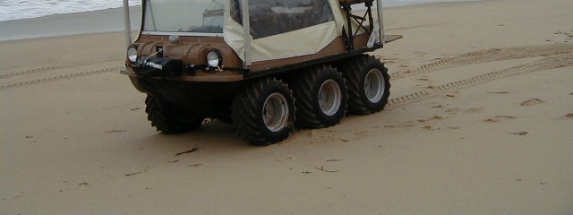 Side-view image of the 6-wheel amphibious buggy used by the SWASH system