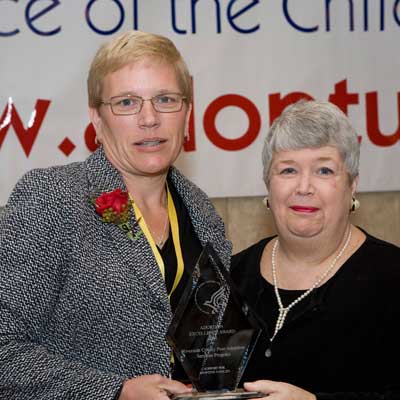 Picture of Joan Ohl with an award recipient