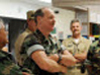 Galveston Island, TX, September 19, 2008 -- Rear Admiral Craig Vanderwagen, Assistant Secretary for Preparedness and Response,  Health and Human Services, center, meets with the members of the Disaster Medical Assistance Team. The DMAT was set up at the University of Texas Medical Branch as a mobile emergency facility following the disruption of power and services to the area due to Hurricane Ike. FEMA News Photo