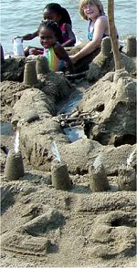 A group of children put the finishing touches on their sandcastle tribute to Saylorville Lake's 25-year anniversary.

Photo by Kelly Ulrick-Blackledge, park ranger, Saylorville Lake.