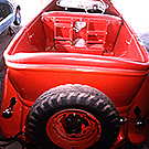 Image of President Lyndon B. Johnson's red car at the Johnson ranch garage