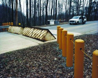 Pictured are pop-up barriers and physical security bollards.  One of the first levels of DNS defense-in-depth approach on physical security. 