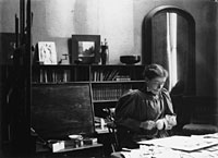 Elizabeth Shippen Green, working at her desk