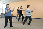 A community group practices Tai Chi, a mind-body practice that originated in China as a martial art. © Bob Stockfield