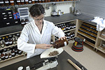 Herbalist weighing dried herbs. © Bob Stockfield