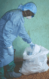 Healthcare employee in protective clothing 