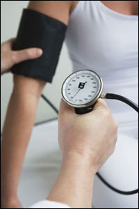 Photo: A woman having her blood pressure checked