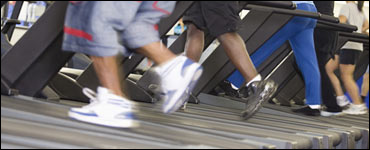 Photo: People running on a treadmill