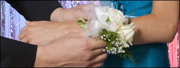 Photo: Putting on a corsage