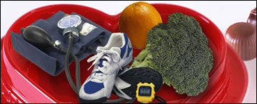 Photo Collage: Blood pressure monitor, running shoes, orange, broccoli