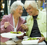 Photo: Two women ejoying a healthy salad