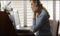 Photo: A woman reading online information.