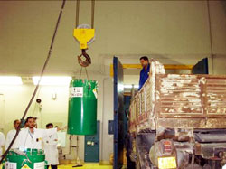 Tajoura workers load one of the TK-S16 containers onto the truck