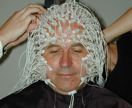 Study volunteer hooked up to a net of electrodes