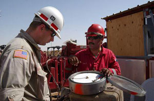 Michael Bishop, ERDC, discusses work with an Iraqi worker