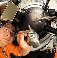 Scientist Yu-Sheng Chen calibrates the needle of the x-ray diffraction machine at ChemMatCARS in the Advanced Photon Source