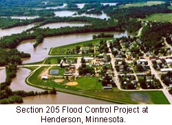 A photo of  a town surrounded by water. Other patches of land covered with trees are also surrounded