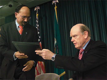 Secretary John Snow and Prime Minister Nelson Oduber of Aruba Sign Tax Information Exchange Agreement