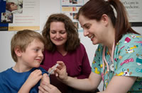 Pre-teen boy receives vaccination