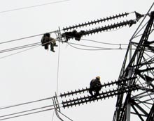 Line crews at the DOE's Bonneville Power Administration work two days in cold, wet and snowy weather to connect a new 500-kilovolt line into the Federal power grid that serves the Pacific Northwest.