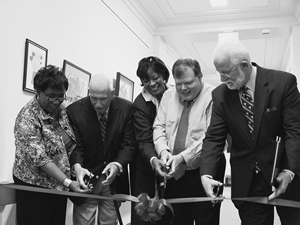Cutting the ceremonial ribbon are Pamela Davenport, Talking Book Services director; John Martin, Talking Book Services advisory chair; Shirley Wilson, South Carolina School for the Blind principal; Marty McKenzie, Department of Education statewide vision consultant; and David Goble, State Library director.