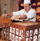 Photo:  chef constructing the White House out of gingerbread.
