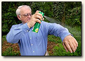 Picture of man spraying DEET
