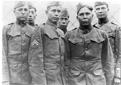 Six men in military uniforms.