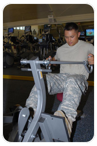Sgt. Michael Nickerson uses one of the new pieces of exercise equipment at the newly remodeled Memorial Fitness Center following a ribbon-cutting ceremony Sept. 25. Sgt. Nickerson is a squad leader assigned to the Warrior Transition Unit.(Photo by Vickey M. Mouze)