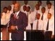 Secretary of Education Rod Paige participates in a September 11th remembrance, with students from the Duke Ellington School of the Arts.