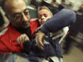 A wounded Palestinian boy is carried into Shifa hospital in Gaza January 4, 2009.  Photo Credit: REUTERS/Suhaib Salem, courtesy www.alertnet.org