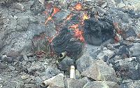 Gas-sampling tube englufed in growing hornito at Son of Cookie Monster skylight on Mother's Day flow, Kilauea volcano, Hawai'i