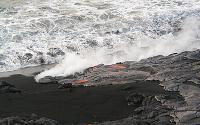 Lava entering water off beach below Highcastle sea cliff in Mother's Day flow, Kilauea volcano, Hawai'i