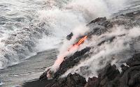 Lava entering water at front of flow covering Highcastle beach, Kilauea volcano, Hawai'i