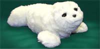 Photo: furry, white, seal pup robot.