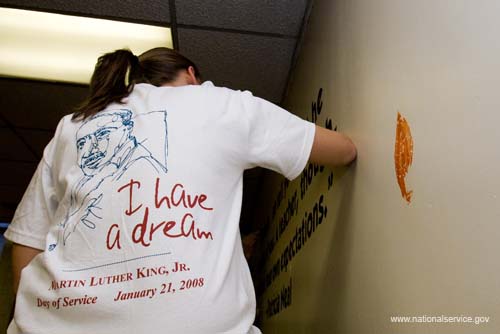 A volunteer’s T-shirt reflects her commitment to the teachings of Martin Luther King as she participates in a 2008 King Day of Service project at Theodore Roosevelt High School in Washington, D.C. About 20,000 people in the District of Columbia participated in nearly 150 service projects in honor of the slain civil rights leader on January 21, 2008.