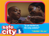 Image from Safe in the City video showing young African American couple in bed holding a condom.