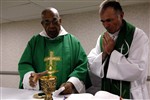 CELEBRATING MASS - Click for high resolution Photo