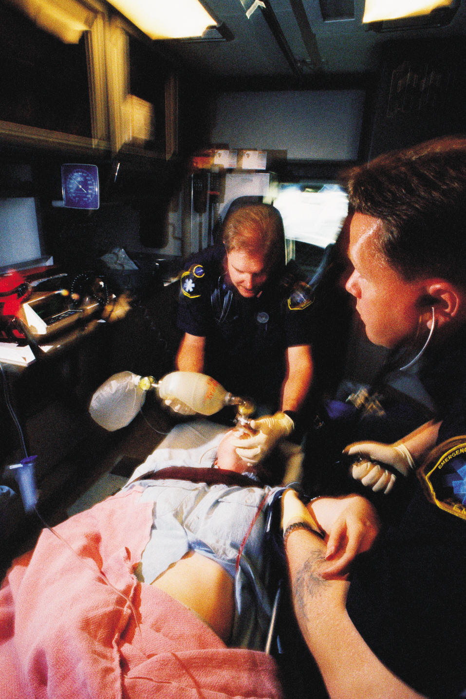Paramedics assisting patient