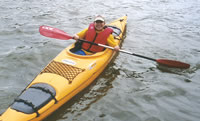 Photo of a young boy on a kayak.