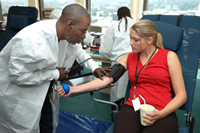 A female patient giving blood.