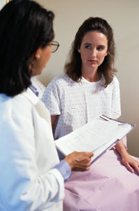 Photo of person talking with physician