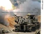 An Israeli mobile artillery unit fires a 155mm shells across the Israeli-Lebanese border 12 July 2006