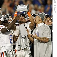 Florida players celebrate with the championship trophy after winning the BCS Championship NCAA college football game against Oklahoma 24-14 in Miami, 08 Jan 2009