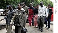 Zimbabwean human rights activists are led into court in Harare on Dec 24 2008