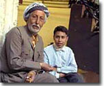 A Kurdish man with his grandson in a souk in Erbil.