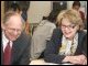 Secretary Spellings and Congressman Castle watch students working on a geometry problem at David W. Harlan Elementary School in Wilmington, Delaware.